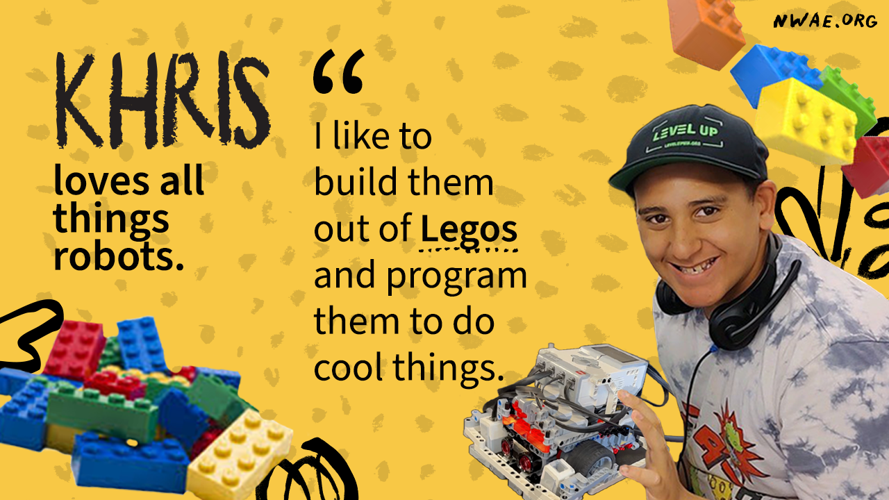 Khris smiling holding a robot he built with legos. "I like to build robots out of legos and program them to do cool things."