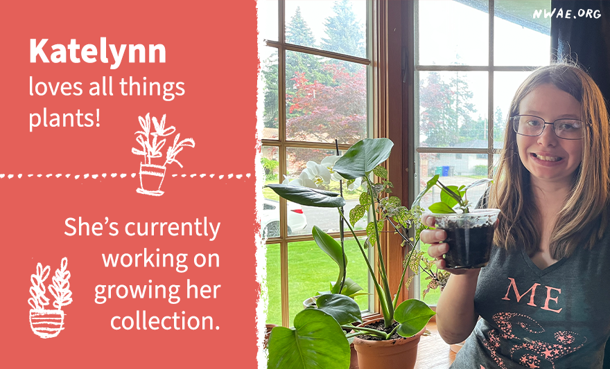 Katelynn smiling holding up one of her propagated plants in front of her other plants. She wants to continue to grow her collectionl